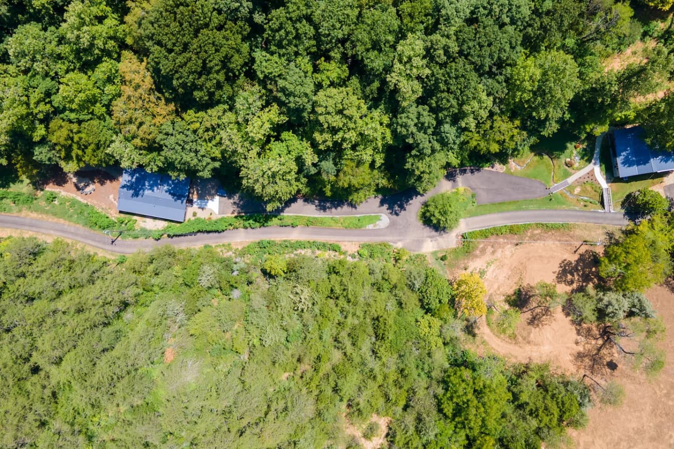 An aerial view of the property showing just part of the sprawling acreage and privacy you’ll enjoy.