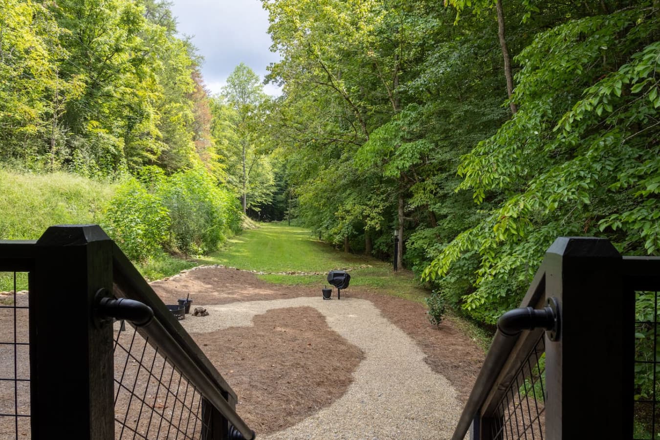 This is the back deck, just past the hot tub overlooking part of the property and the fire pit along with the grill