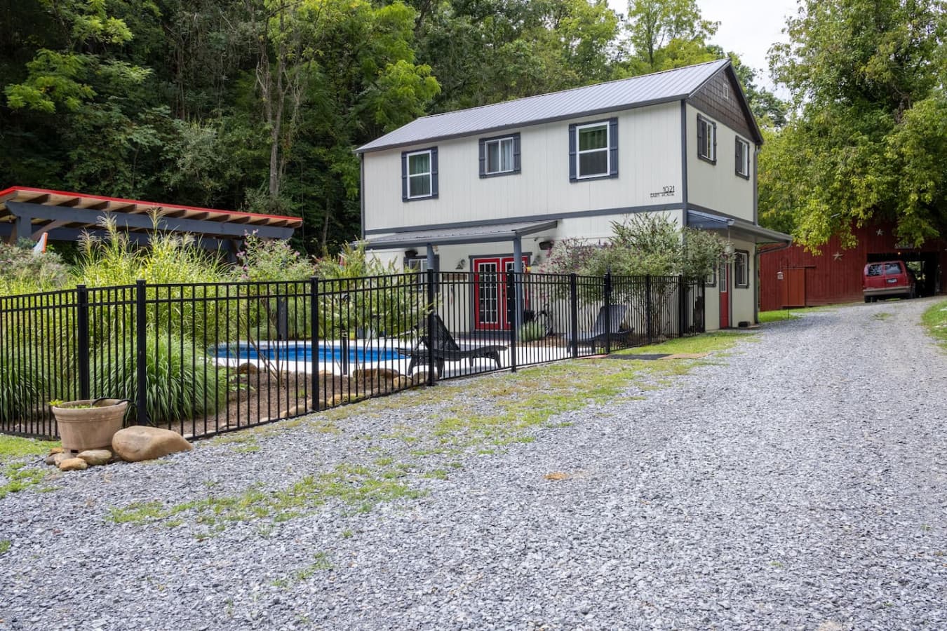 Rustic Curb Appeal: The charming home with classic farmhouse architecture.