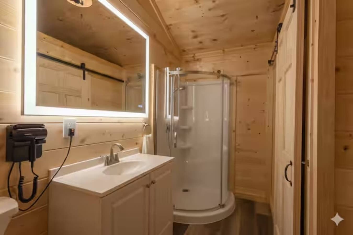 Bright & Clean: Well-lit vanity and spacious shower area for your morning routine.