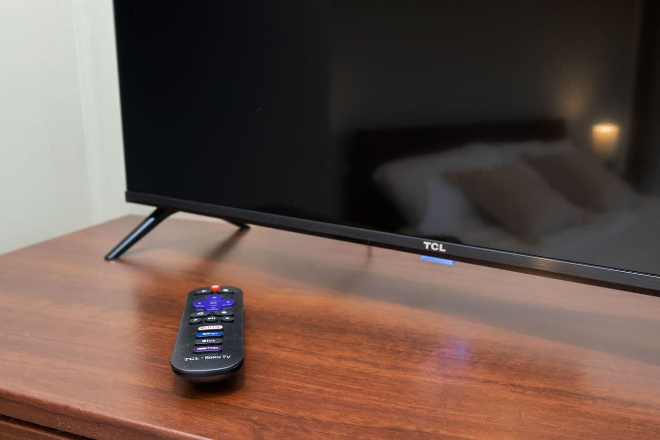 UPSTAIRS-MASTER BEDROOM: The TCL Roku Smart TV is a smart television with the integrated Roku system, allowing access to various streaming services.