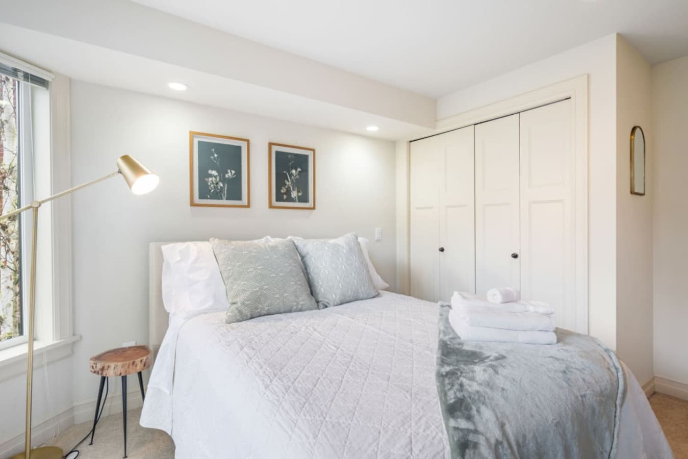2nd FLOOR BEDROOM 2 : Ample closet space and a tall floor lamp.