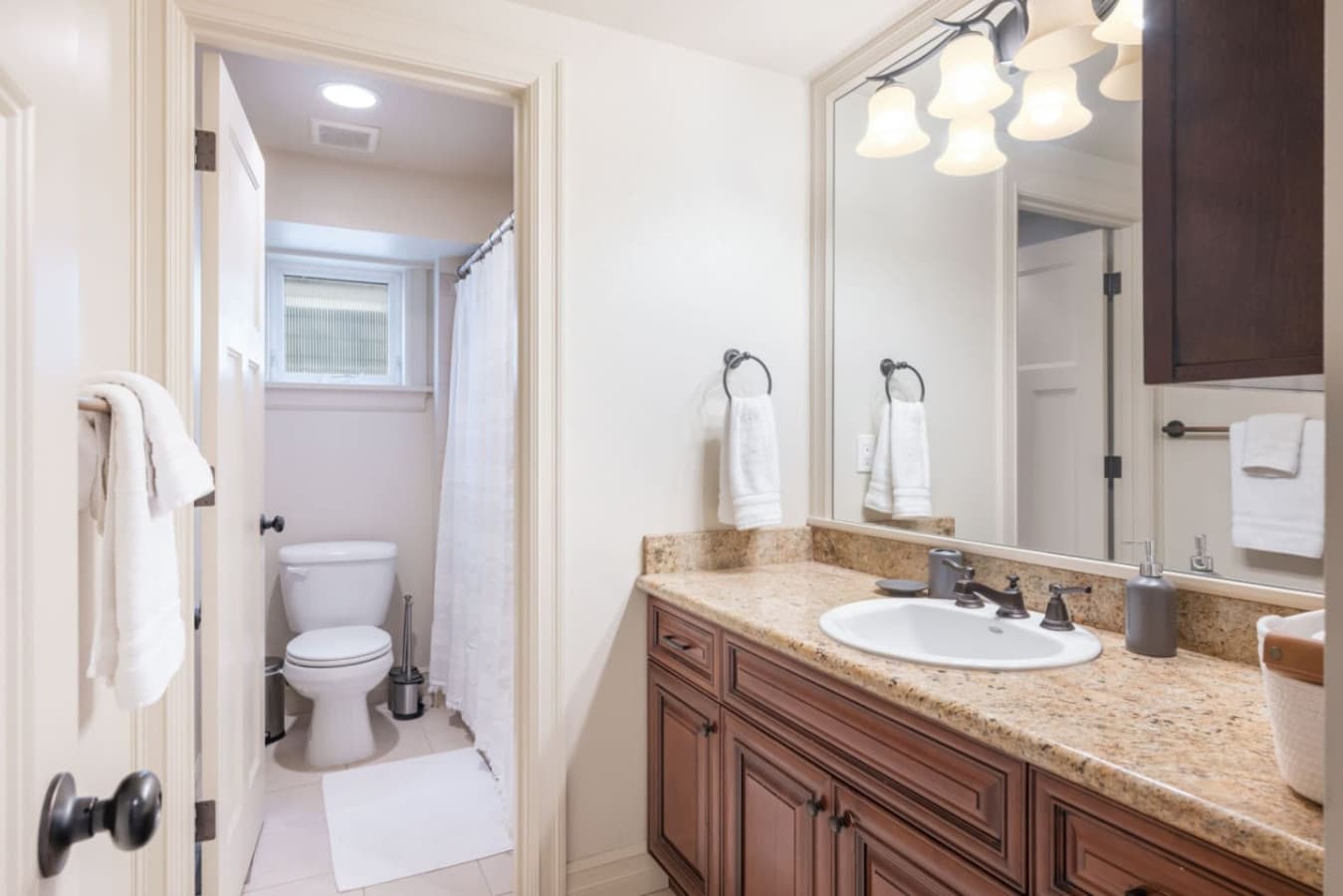 2nd FLOOR BATHROOM: This central bathroom offers ample storage and counter space, and a bathtub/shower combo. Guests enjoy complimentary toiletries, a hairdryer, and shower gel.