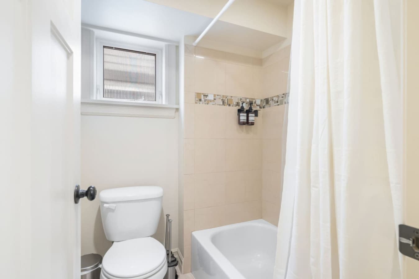 BATHROOM: This central bathroom offers ample storage and counter space, and a bathtub/shower combo. Guests enjoy complimentary toiletries, a hairdryer, and shower gel.