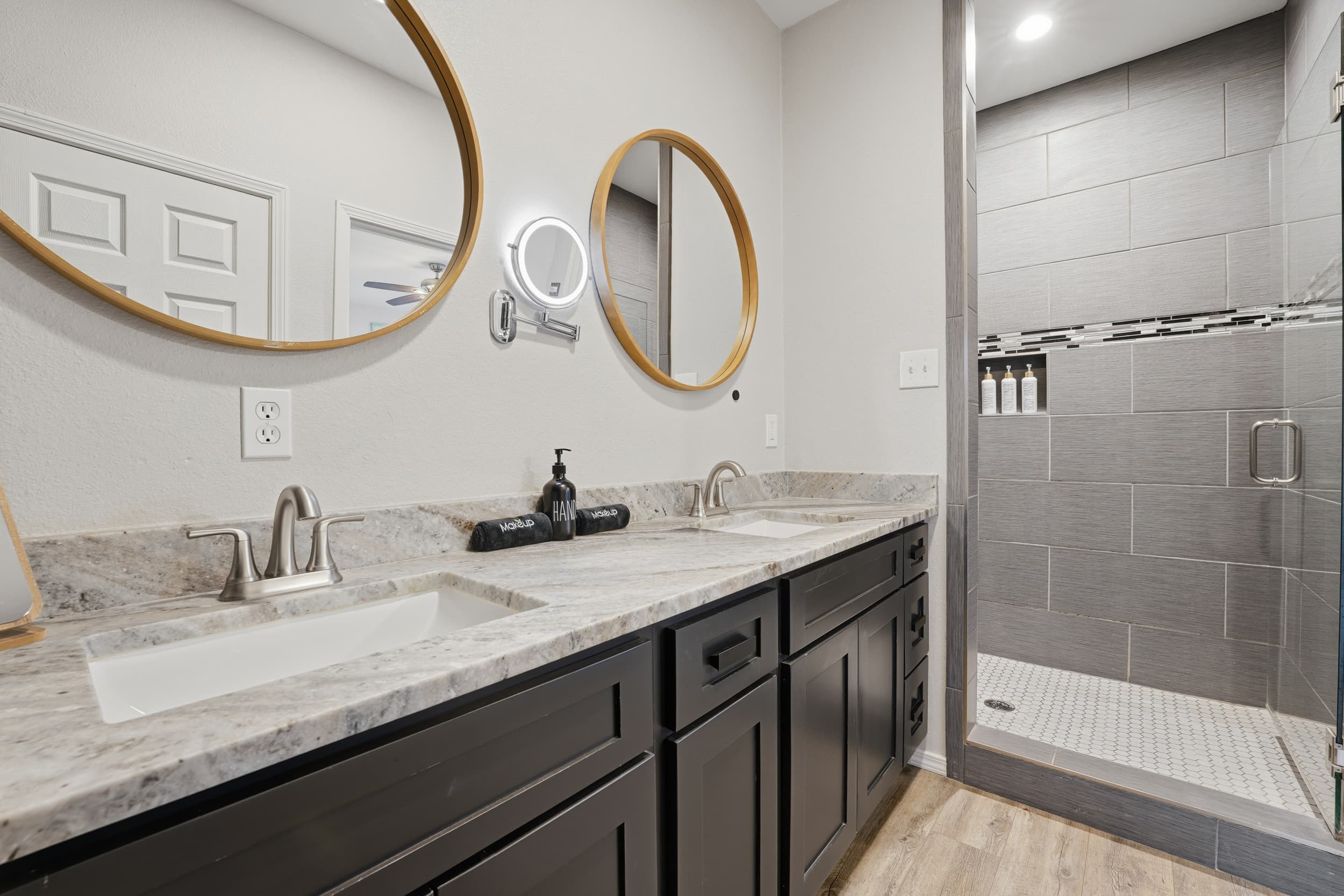 Spacious en-suite bathroom with fresh towels and essentials provided