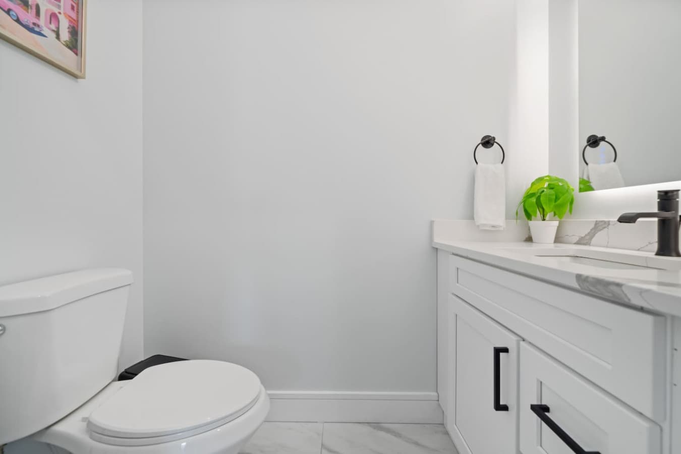 Half bathroom located downstairs in the home