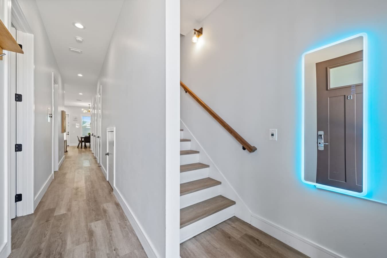 Just past the entryway is stairs to the second level on your right and the two downstairs bedrooms, kitchen, dining area and living room straight ahead.