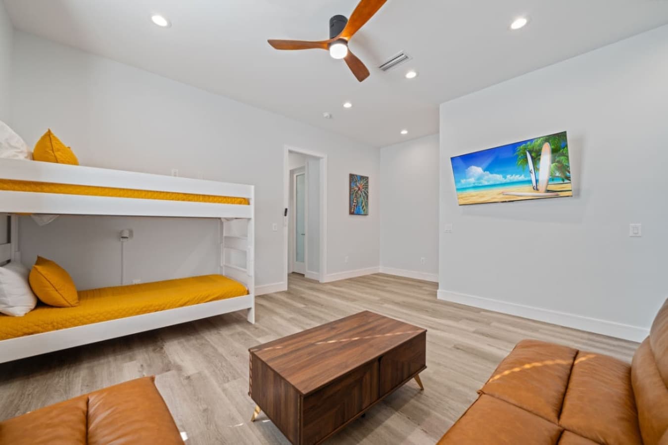 Second living space upstairs in the home including a large smart TV