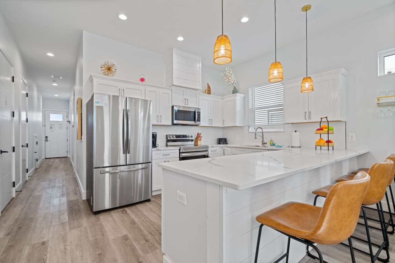 Towards the back of the home is the kitchen space