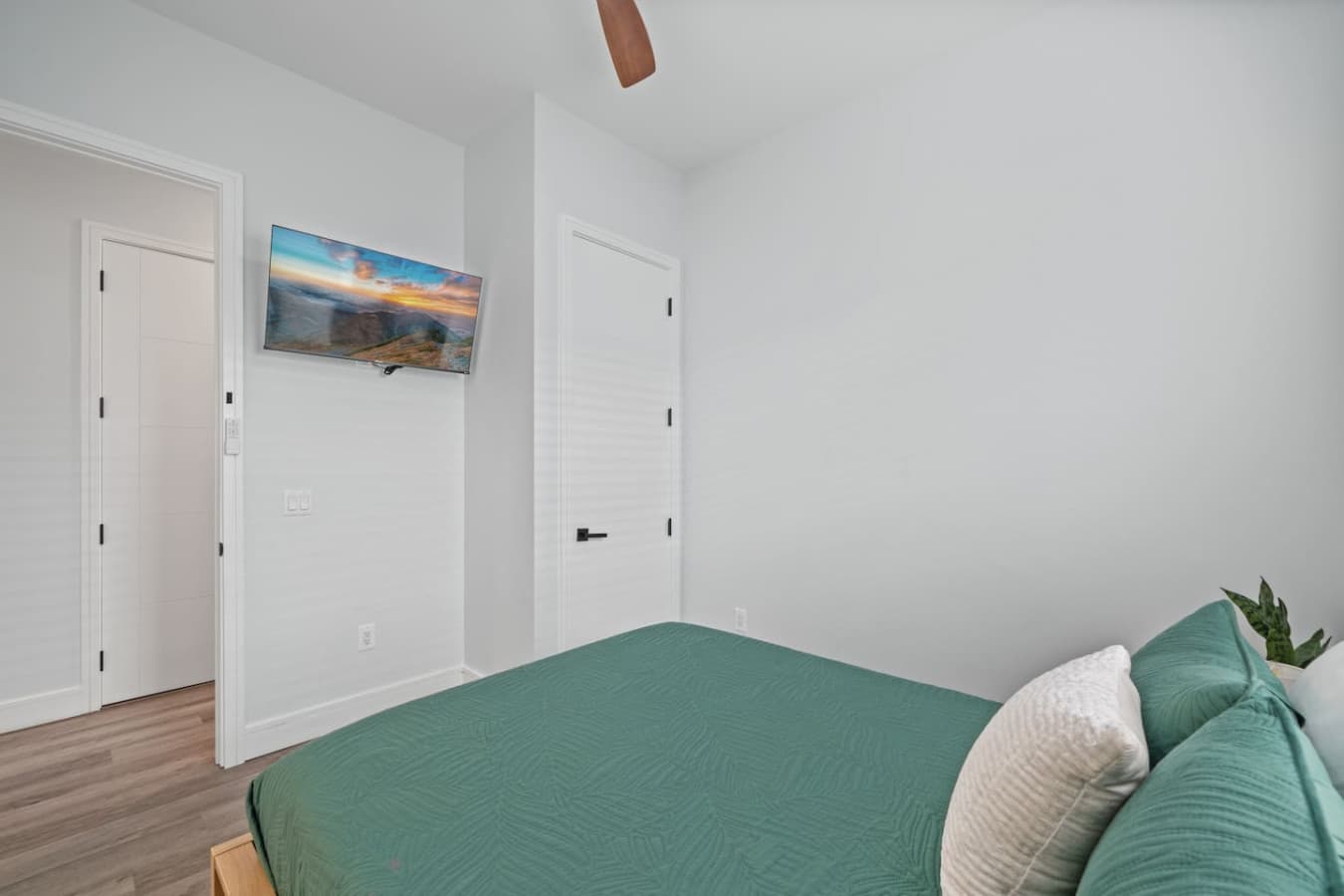 Queen bedroom located downstairs and with a large smart TV