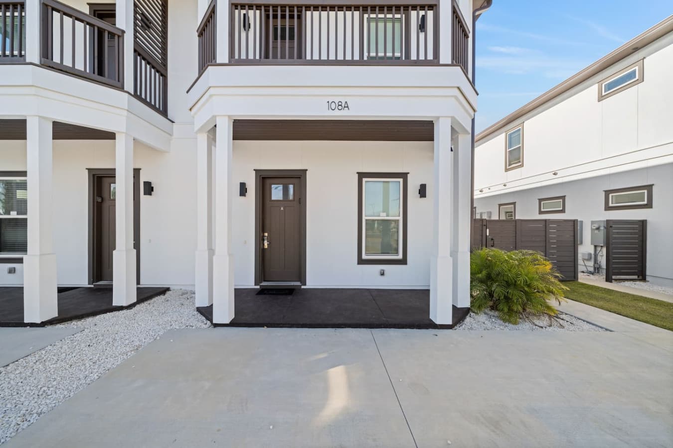 A duplex that is 5 bedrooms and has a backyard with a deck and pool
