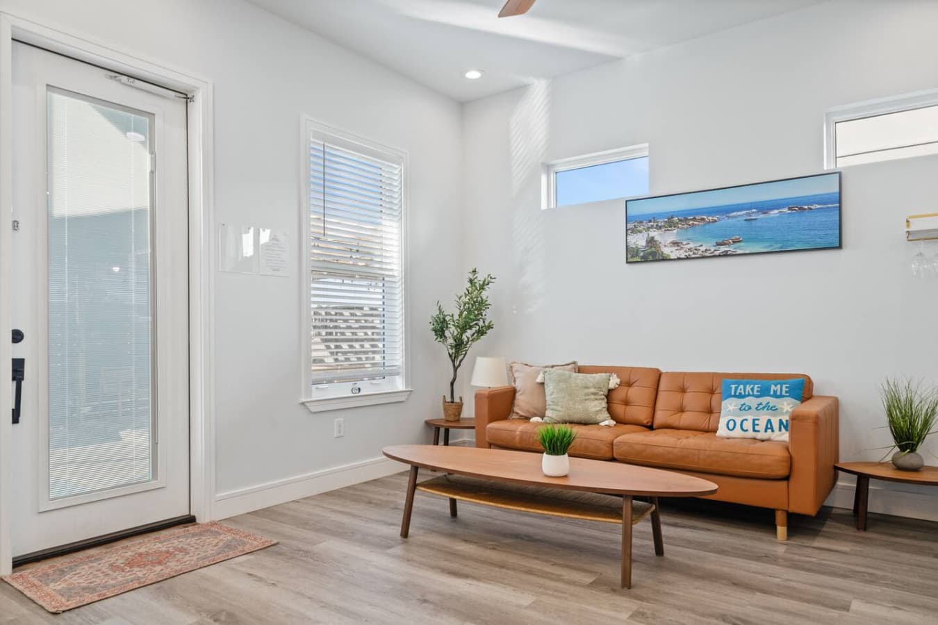 The living room leads directly to the backyard and pool area