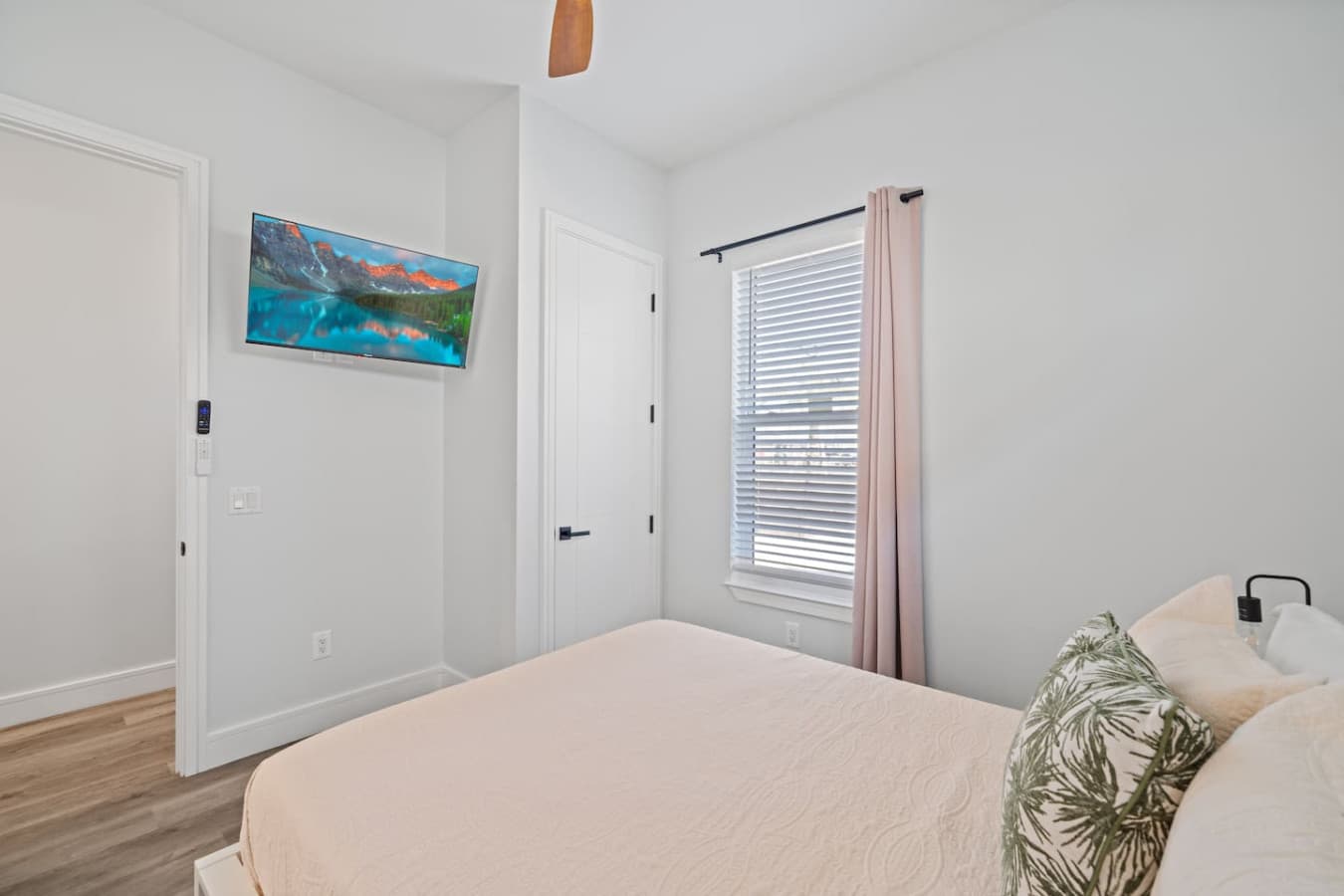 The other King bedroom located upstairs in the home with a large smart TV