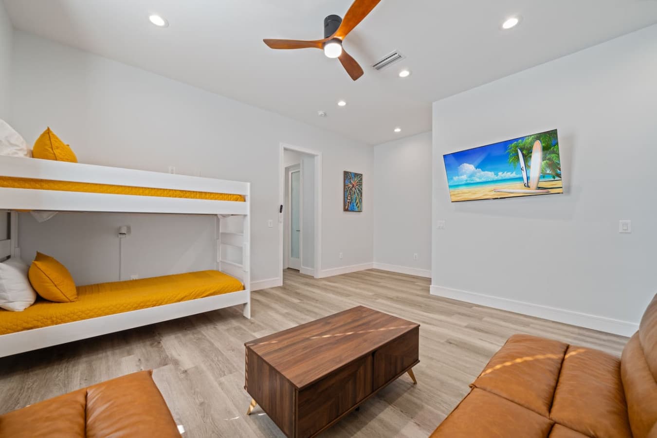 The living space upstairs is complete with additional bedding as well as a large smart TV