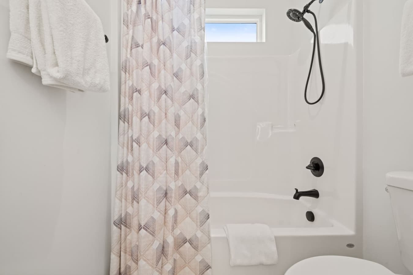 Jack and jill bathroom downstairs with shower/tub combo