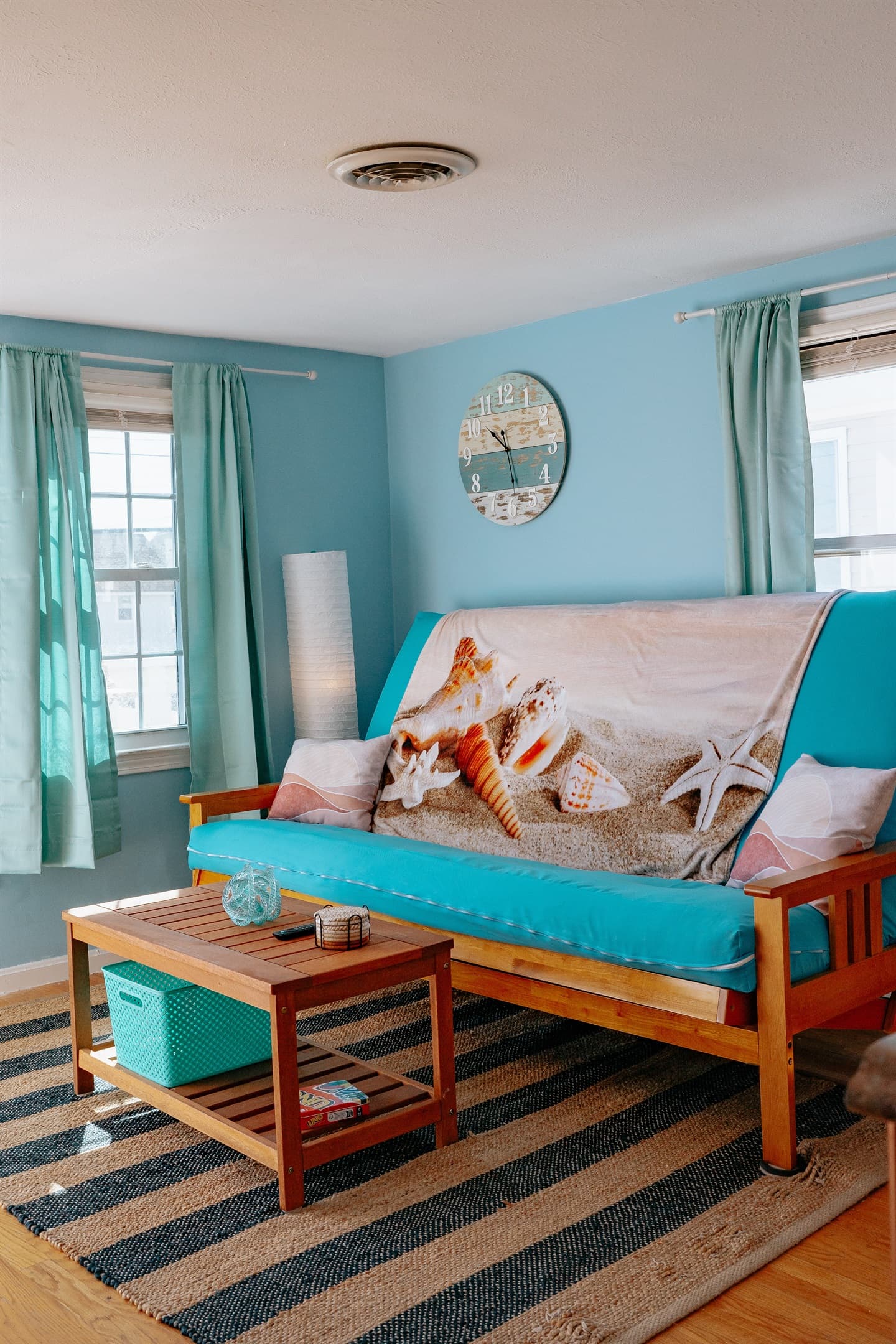 a view of the living room, complete w/queen size pull down futon couch & coffee table. This room has an air conditioner in the window during the on-season.