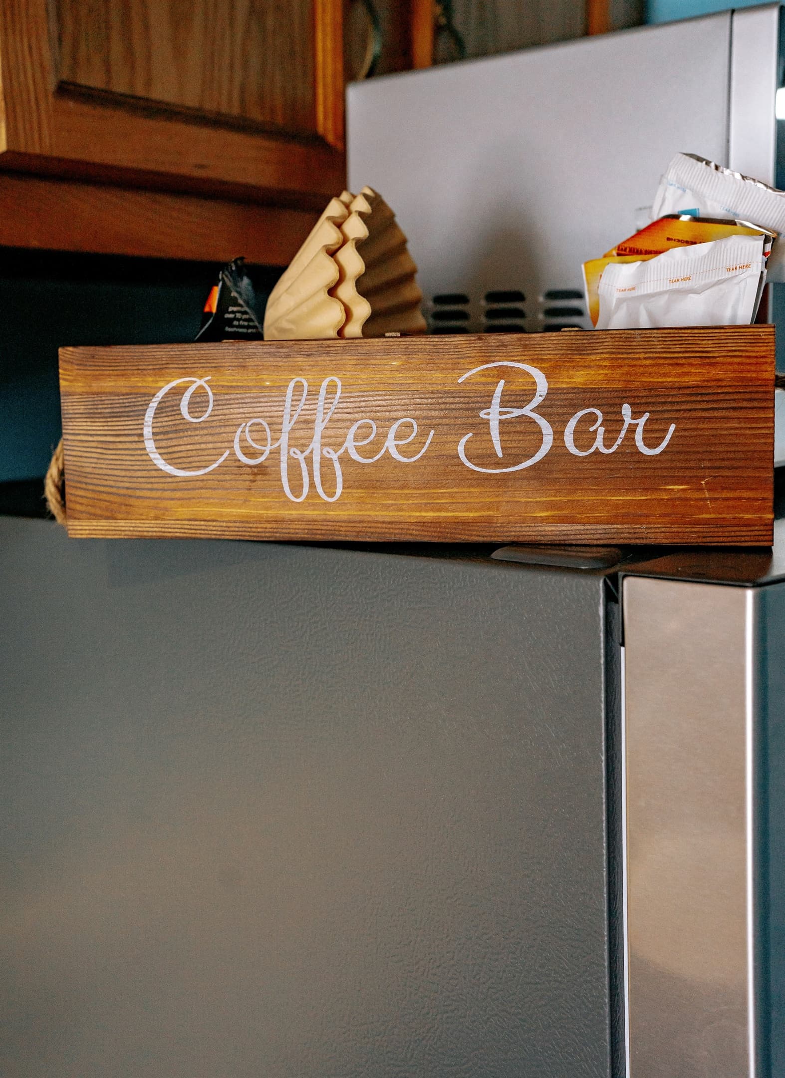 the coffee bar that lives on top of the fridge. It typically includes various coffee, filters, sugar & creamer, and various teas & hot chocolates