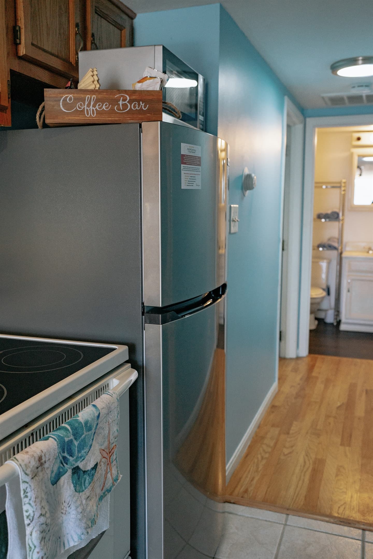 this was taken in the kitchen and shows the brand new refridgerator, thermostat, the entrance into the master bedroom & bedroom