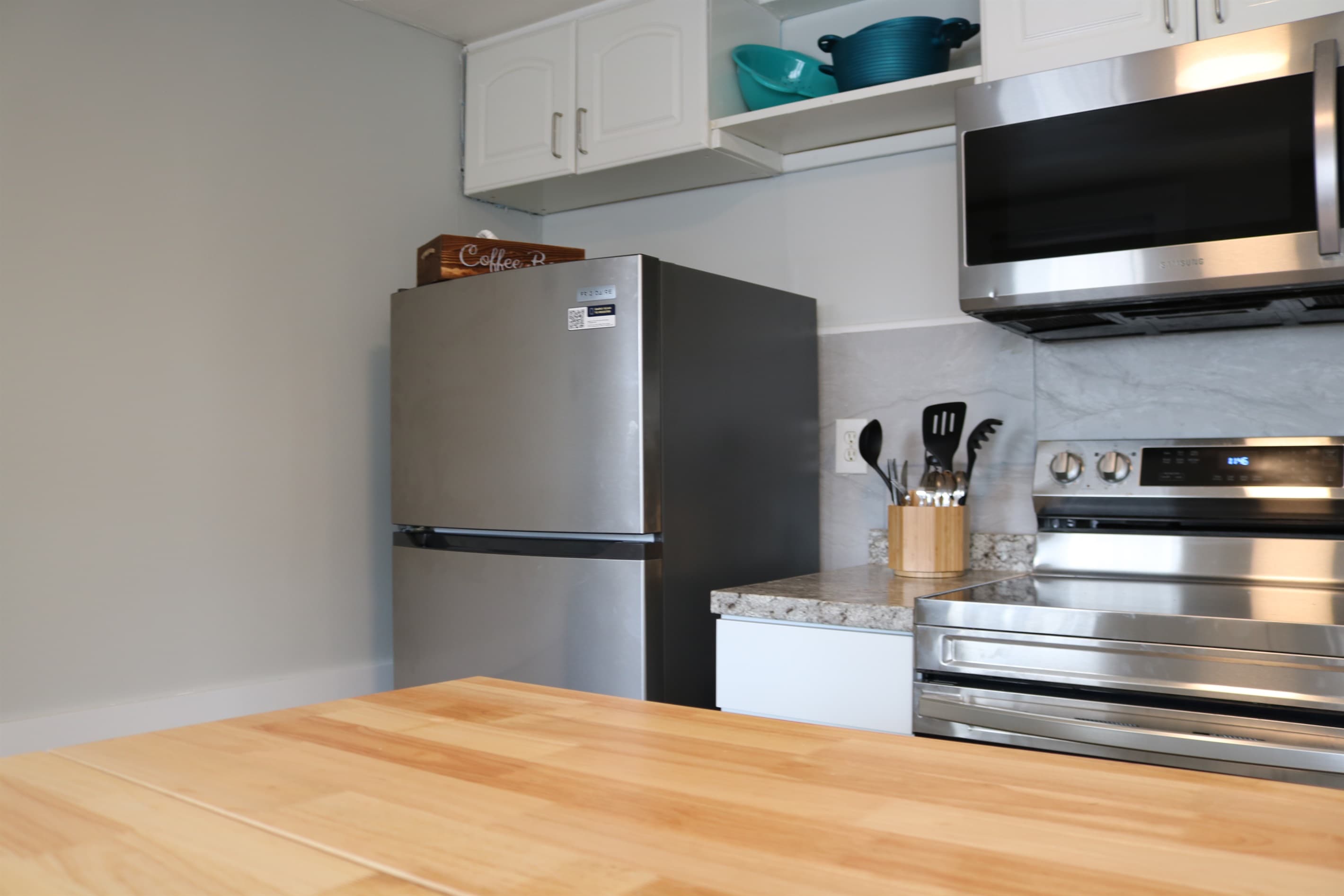 a fully stocked kitchen awaits complete with an island with seating for 2 and all the essentials.