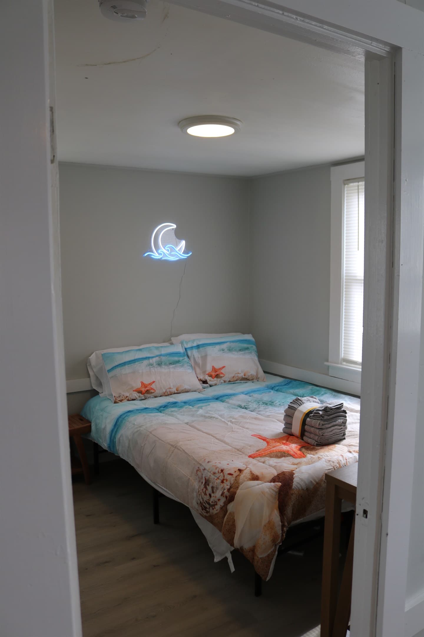 bedroom #2, complete with 32" Amazon Fire TV, a rack for your clothes, and A/C unit