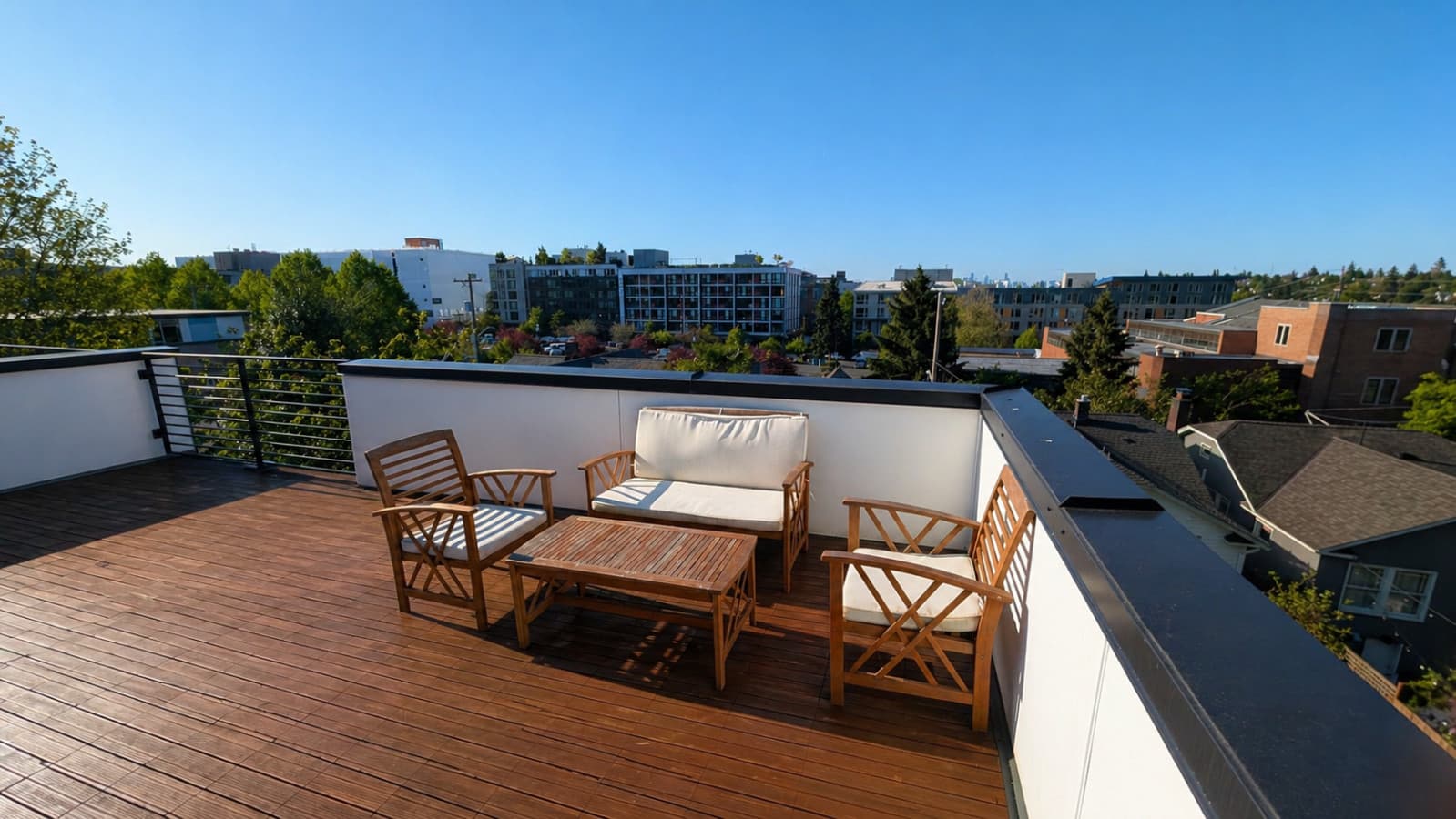 Featuring a spacious wooden deck and comfortable seating, it’s perfect for morning coffee or evening drinks, with open city views creating a calm and inviting atmosphere..png