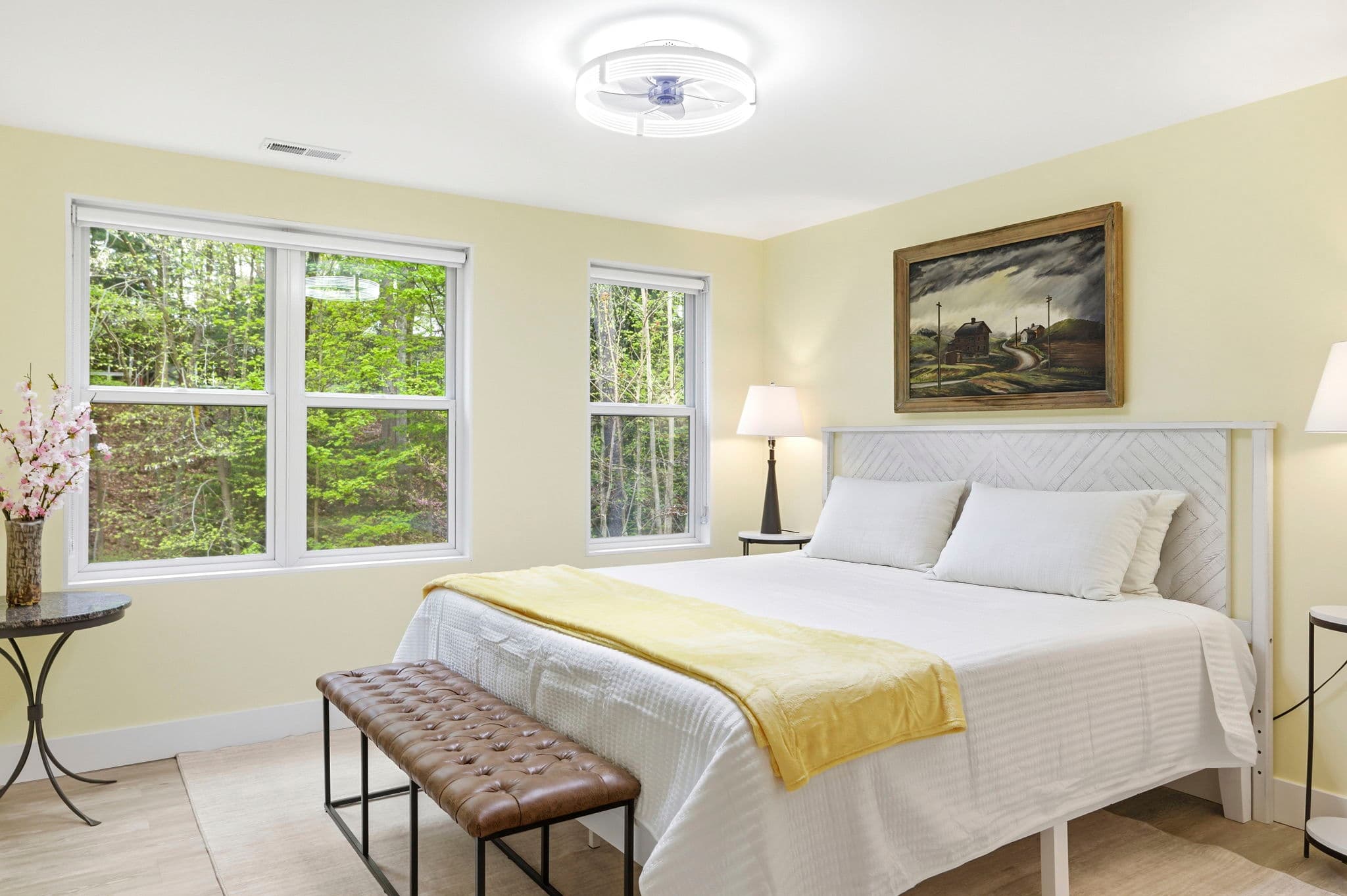 Bright and comfortable bedroom with a king bed and twin alcove bed