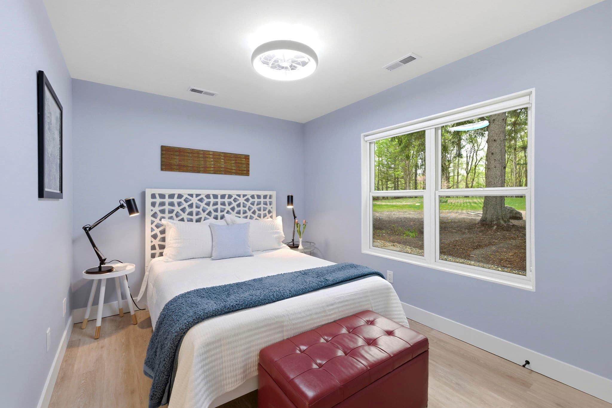 Bedroom One has a queen bed. It has a lovely view of the five giant Norway Spruce trees in the front.