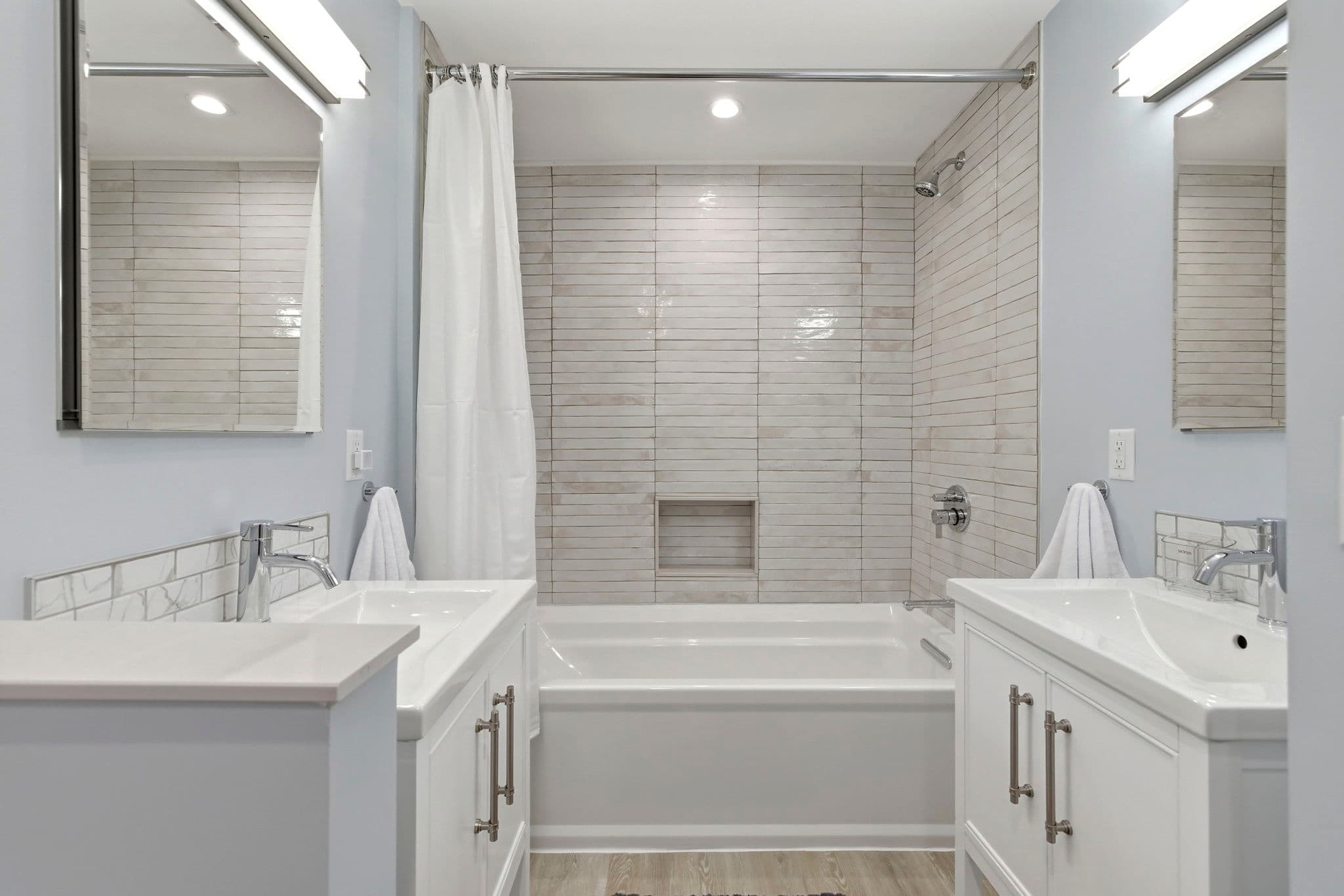 Bathroom Two is shared by Bedrooms One and Two. The tub is almost 6' long.