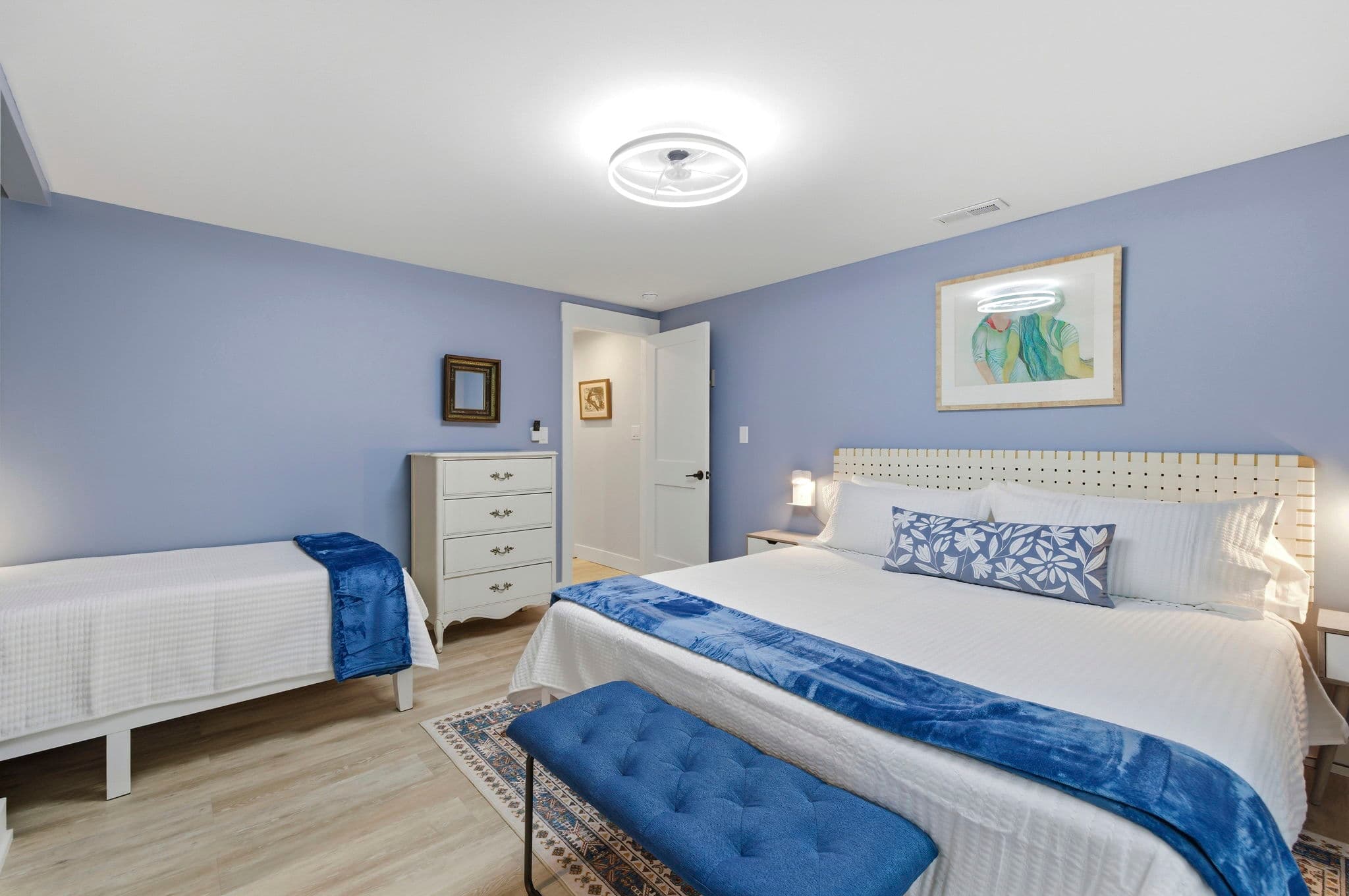 Bedroom Three is off the north hall. It features a king bed and a twin.