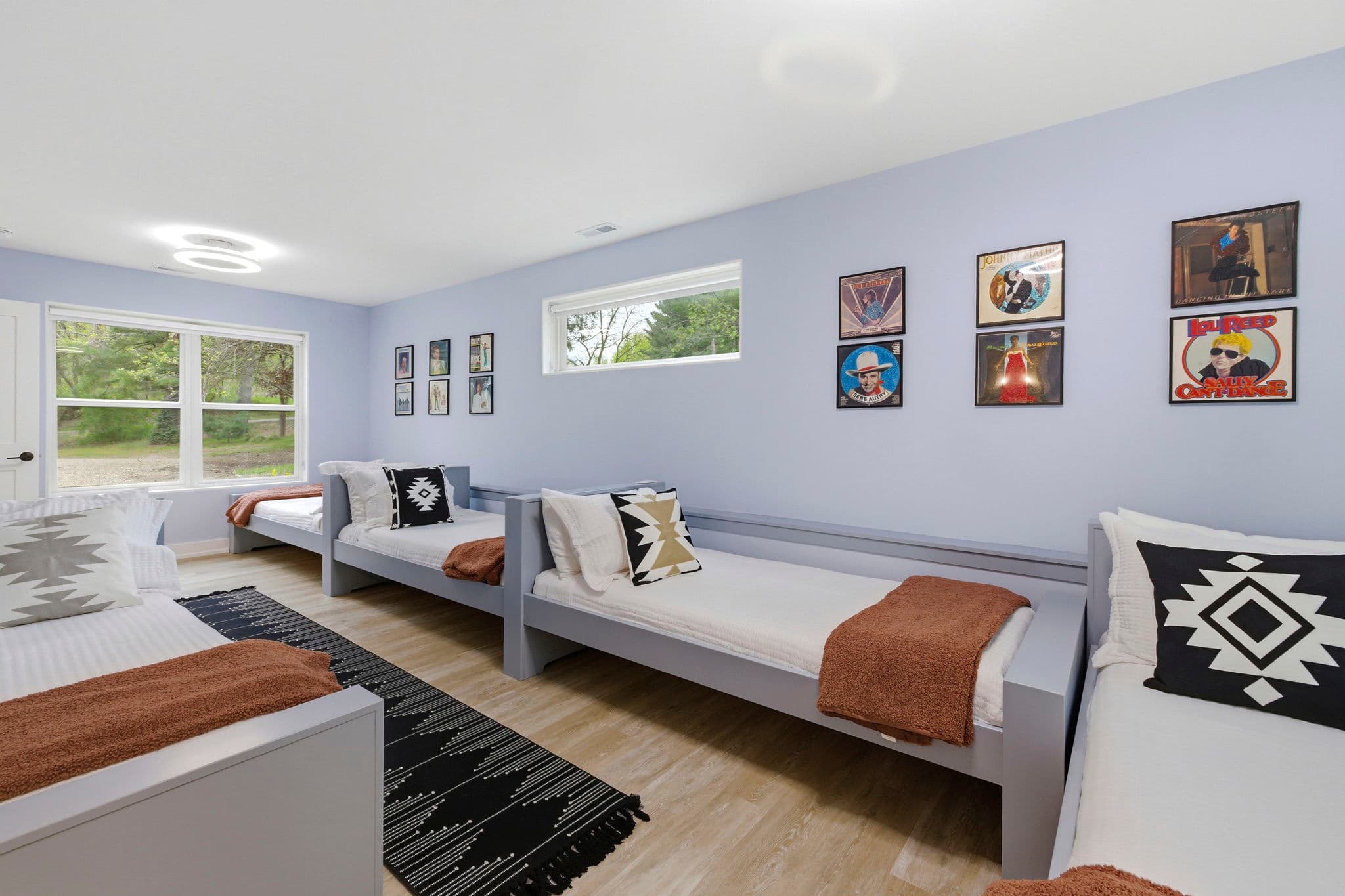 Bedroom Six, a/k/a the Dorm, has 5 twin beds, each with its own small reading light.