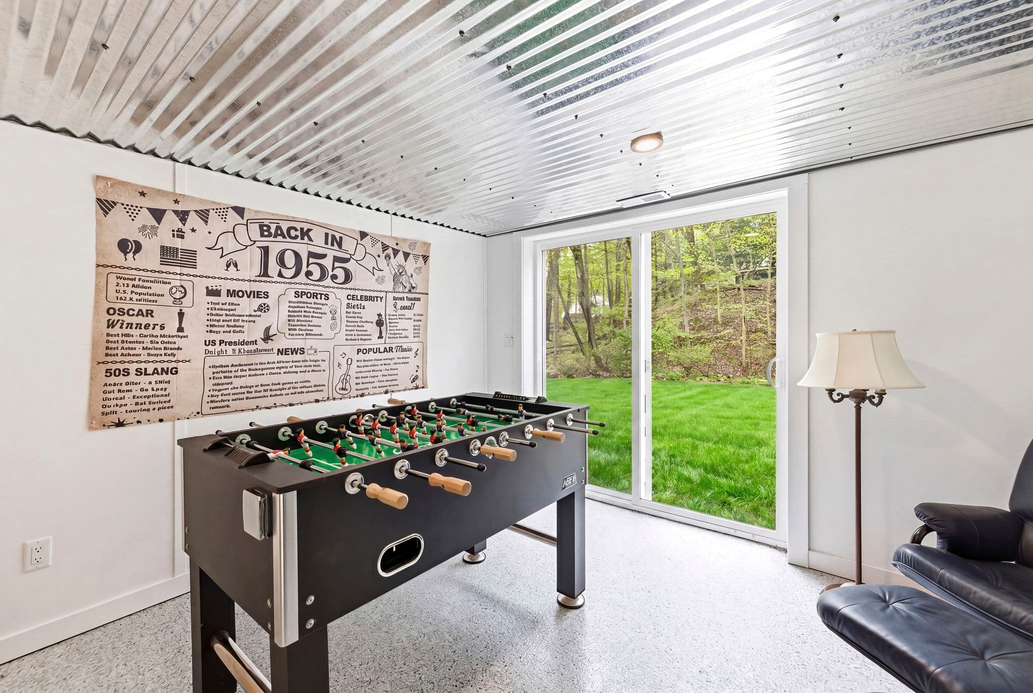 Game room with foosball and backyard views