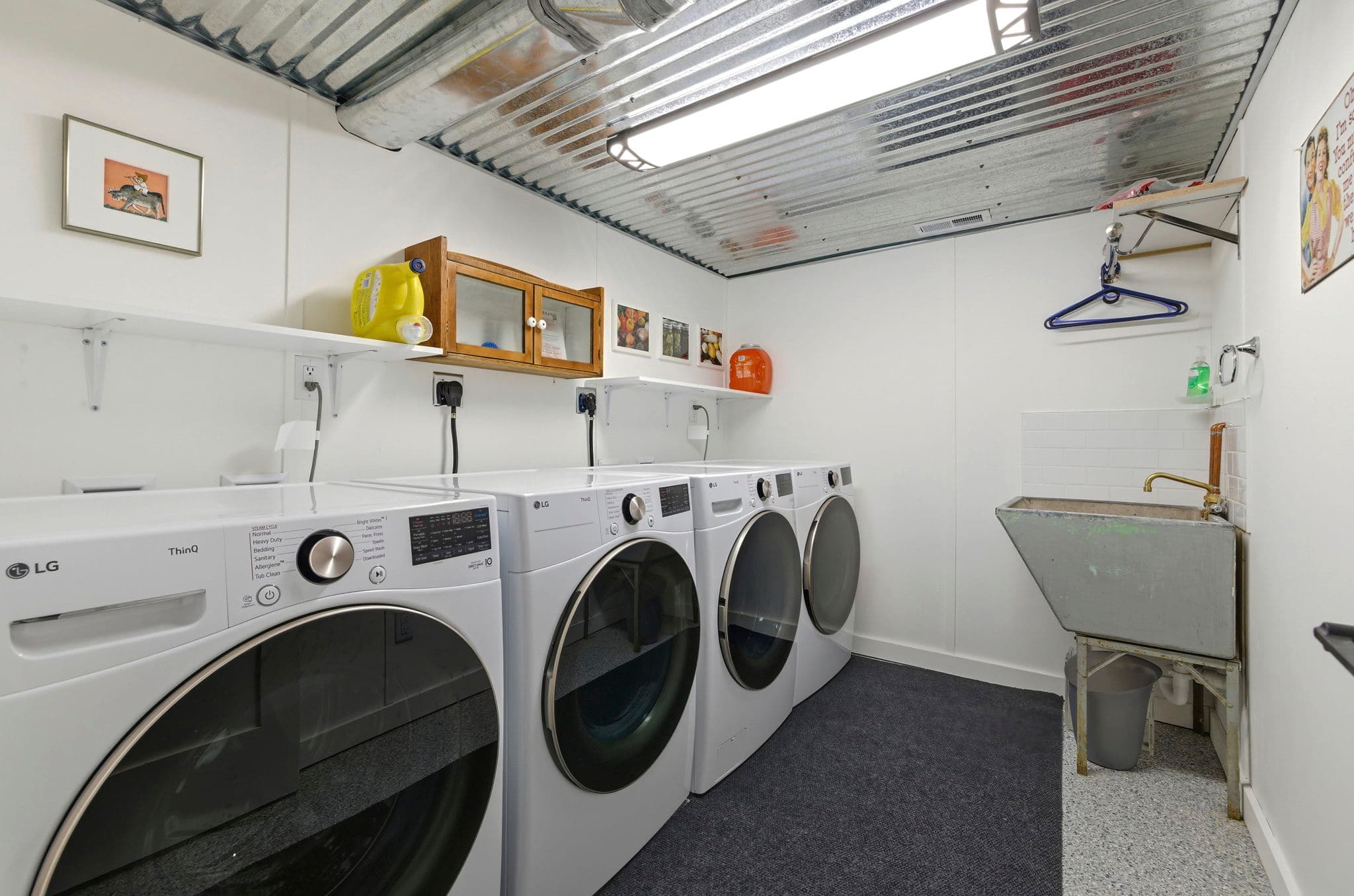 Laundry room with multiple washers and dryers, perfect for extended stays and large groups