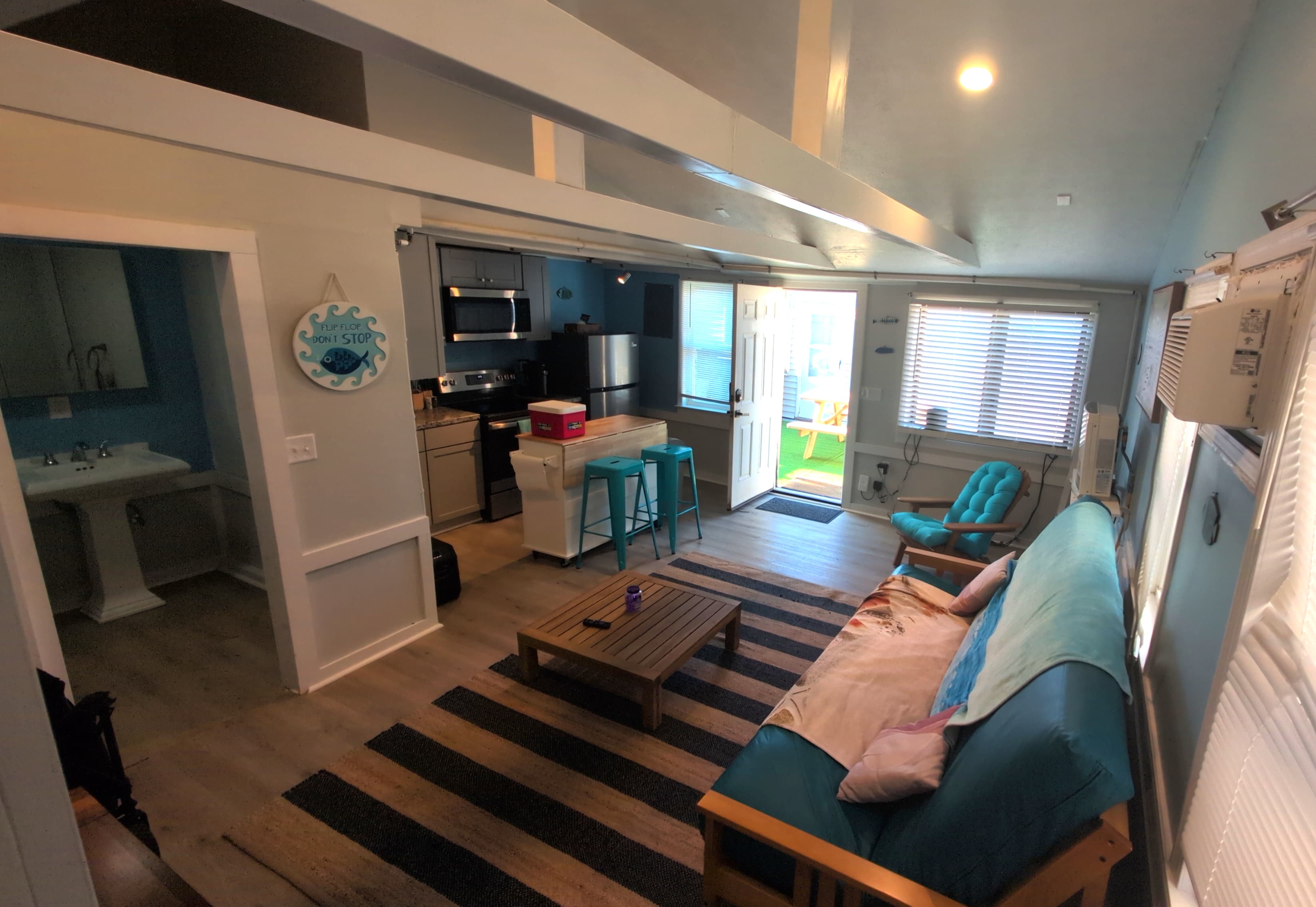 view of the living room and kitchen from the bedroom looking towards the front of the house