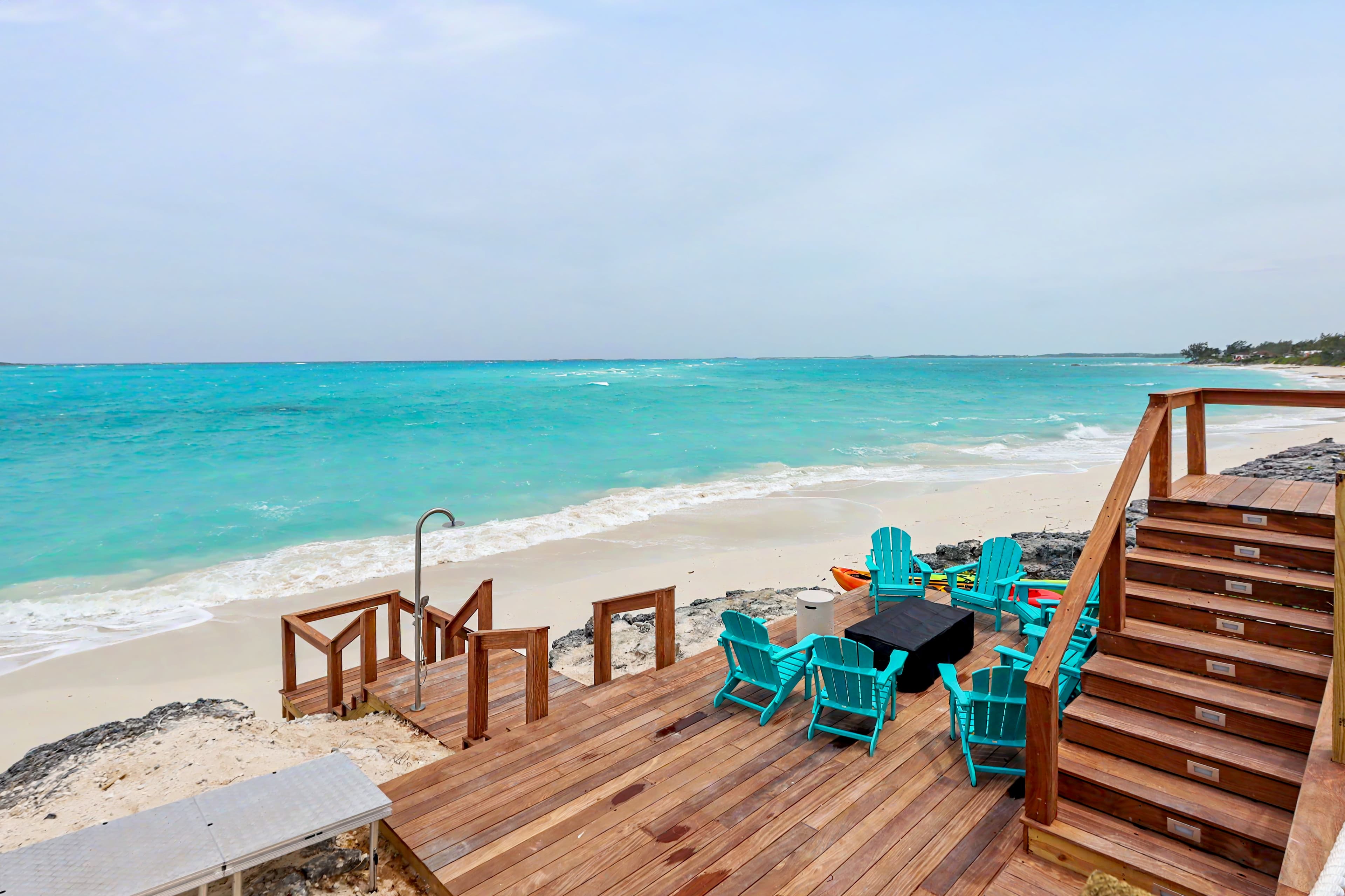 Lower Deck with Firepit and outdoor shower with steps to the beach
