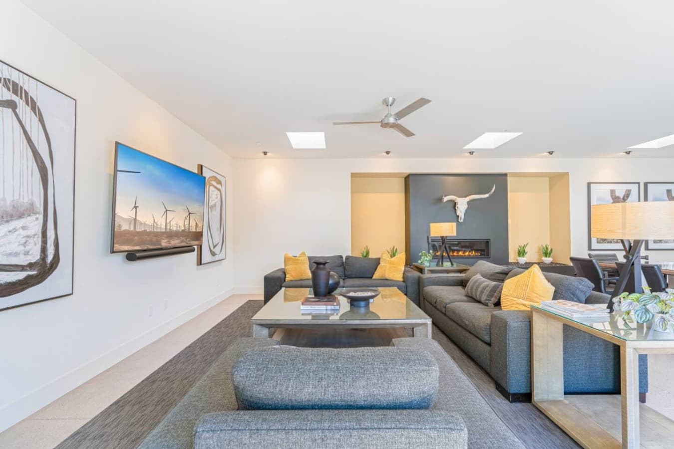 Bright open living space w/ comfy seating, large TV, and easy flow into the kitchen for relaxed group time.