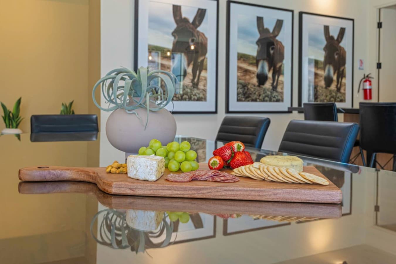 Styled kitchen island moment w/ fresh fruit, greenery, and a welcoming setup for snacks or drinks.