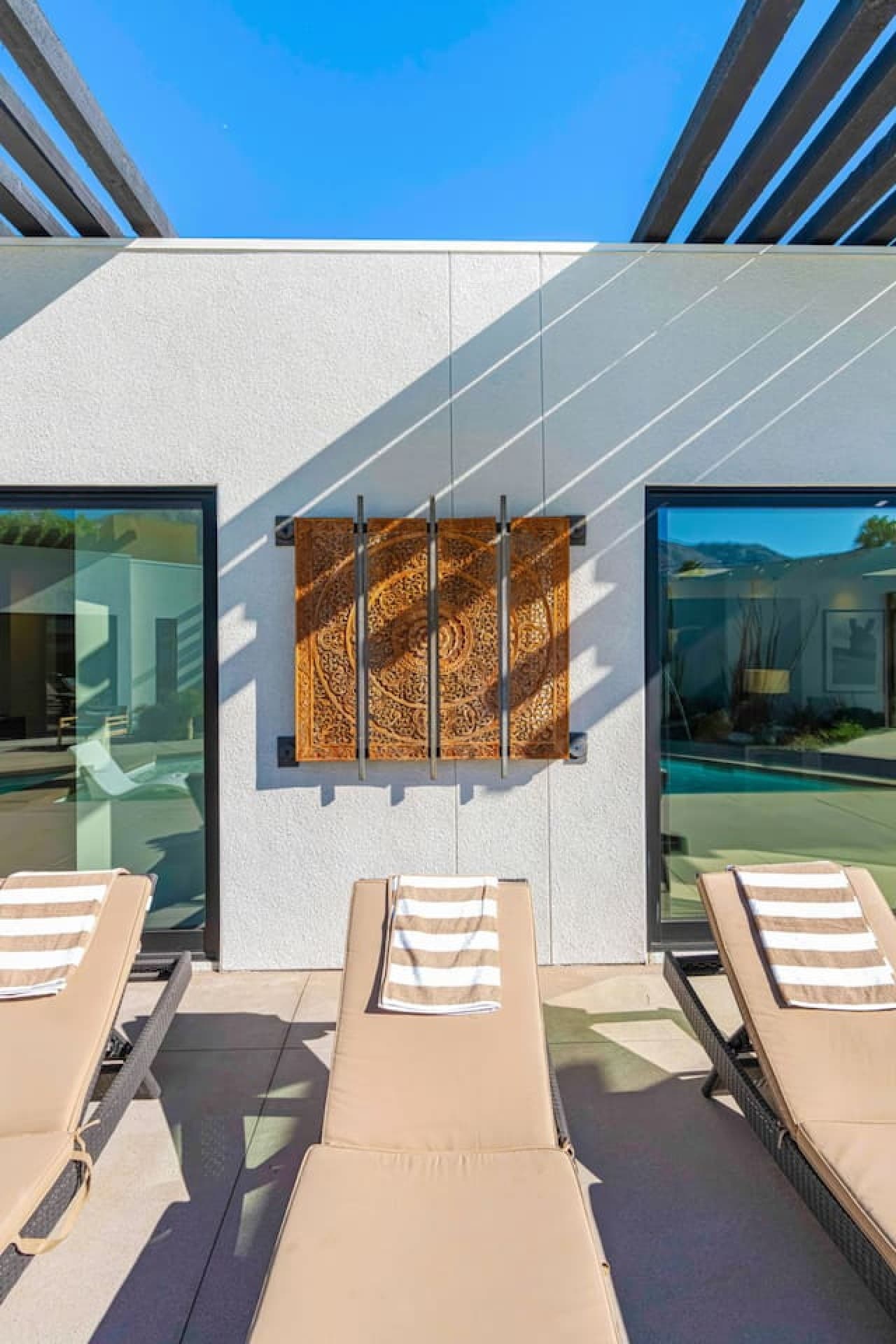 Exterior detail showcasing modern textures, desert materials, and clean architectural lines.