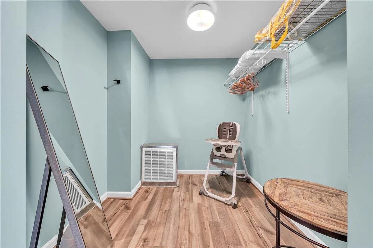 Highchair in primary bedroom closet