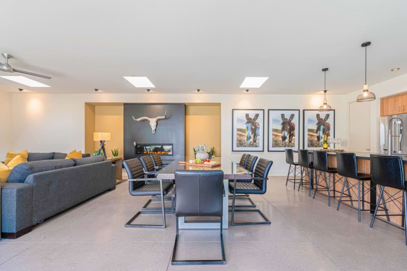 Spacious living & dining area w/ comfy seating, long table, and an easy setup for group gatherings.