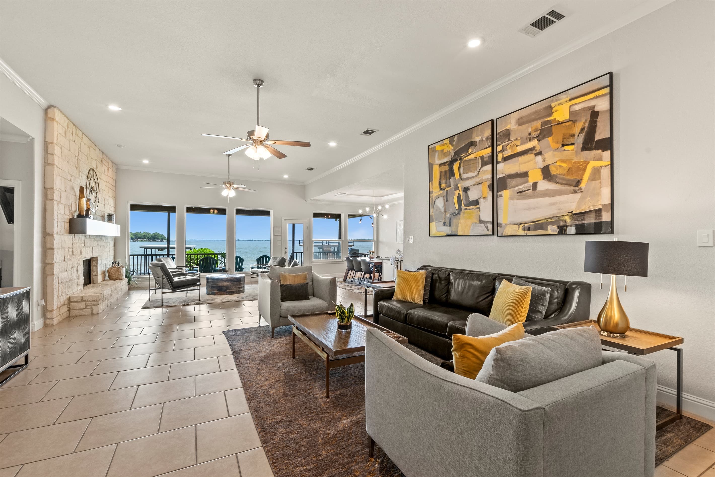 Relax in style with plush seating in the spacious family and living rooms, framed by expansive windows showcasing breathtaking open-water views.