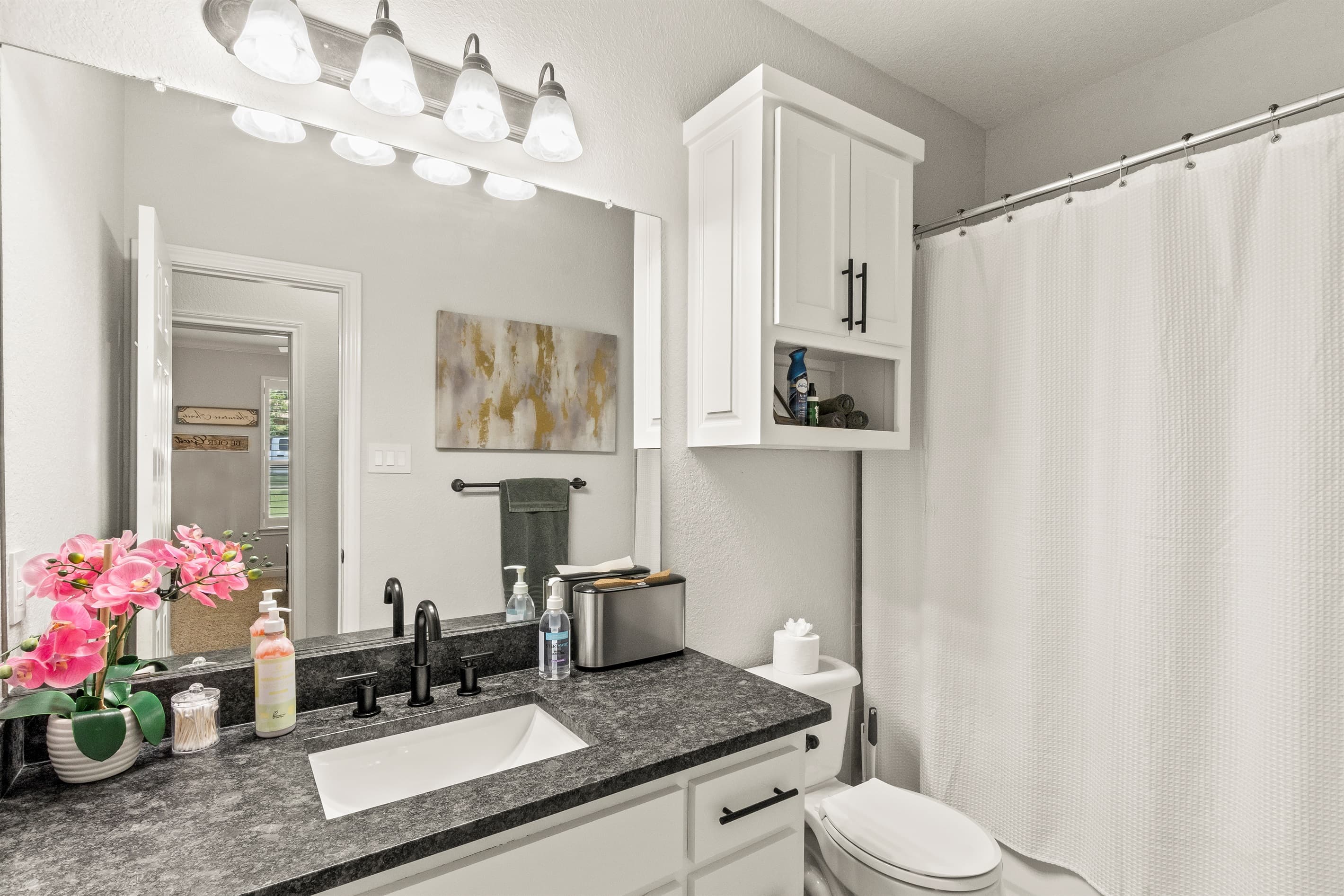 Elegant guest bathroom conveniently shared by Bedrooms #3 and #4, designed for comfort and style.