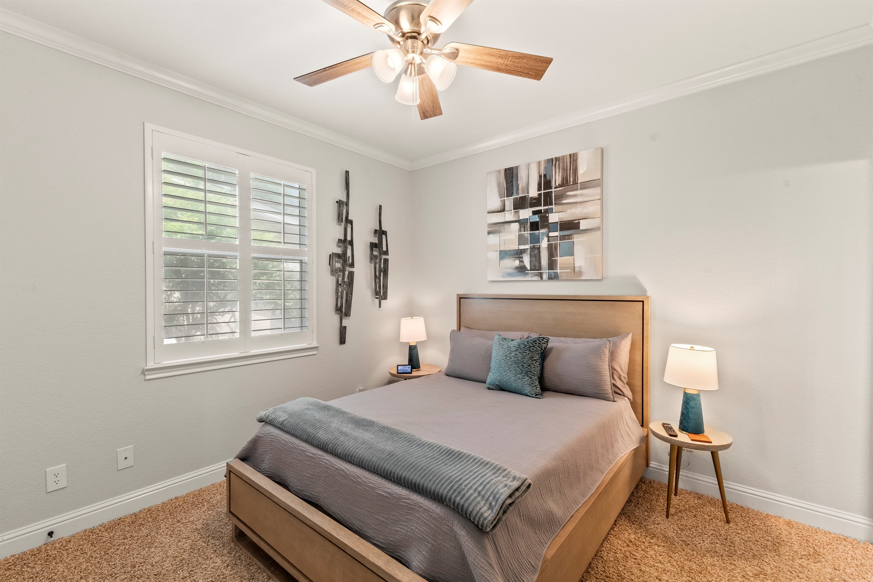 Bedroom #2 offers a serene escape with a queen-size bed and a 49-inch Smart TV—perfect for unwinding in comfort.