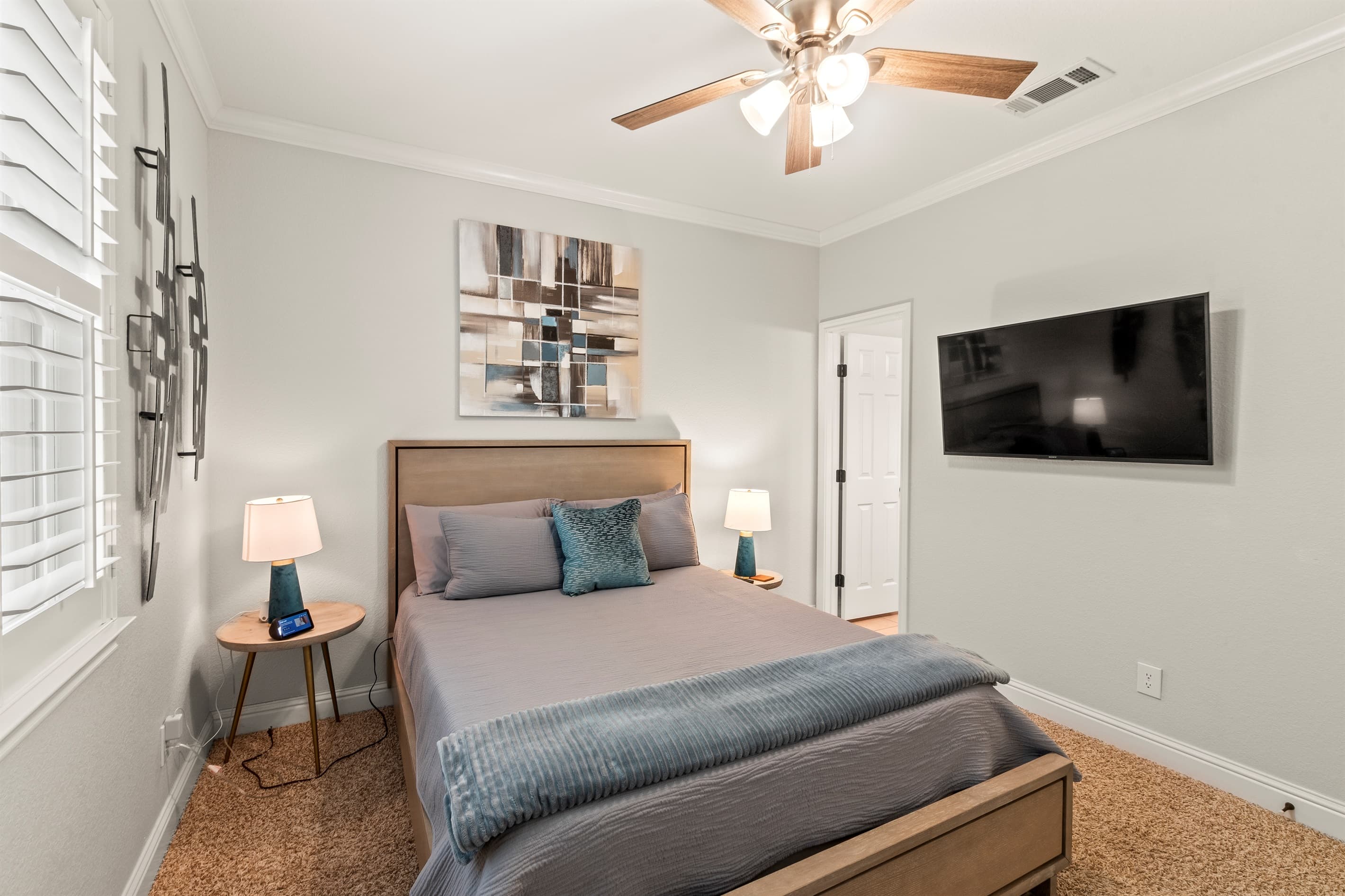 Bedroom #2: A private retreat featuring a queen bed, en-suite bathroom, and a 49-inch TV for added comfort and convenience.