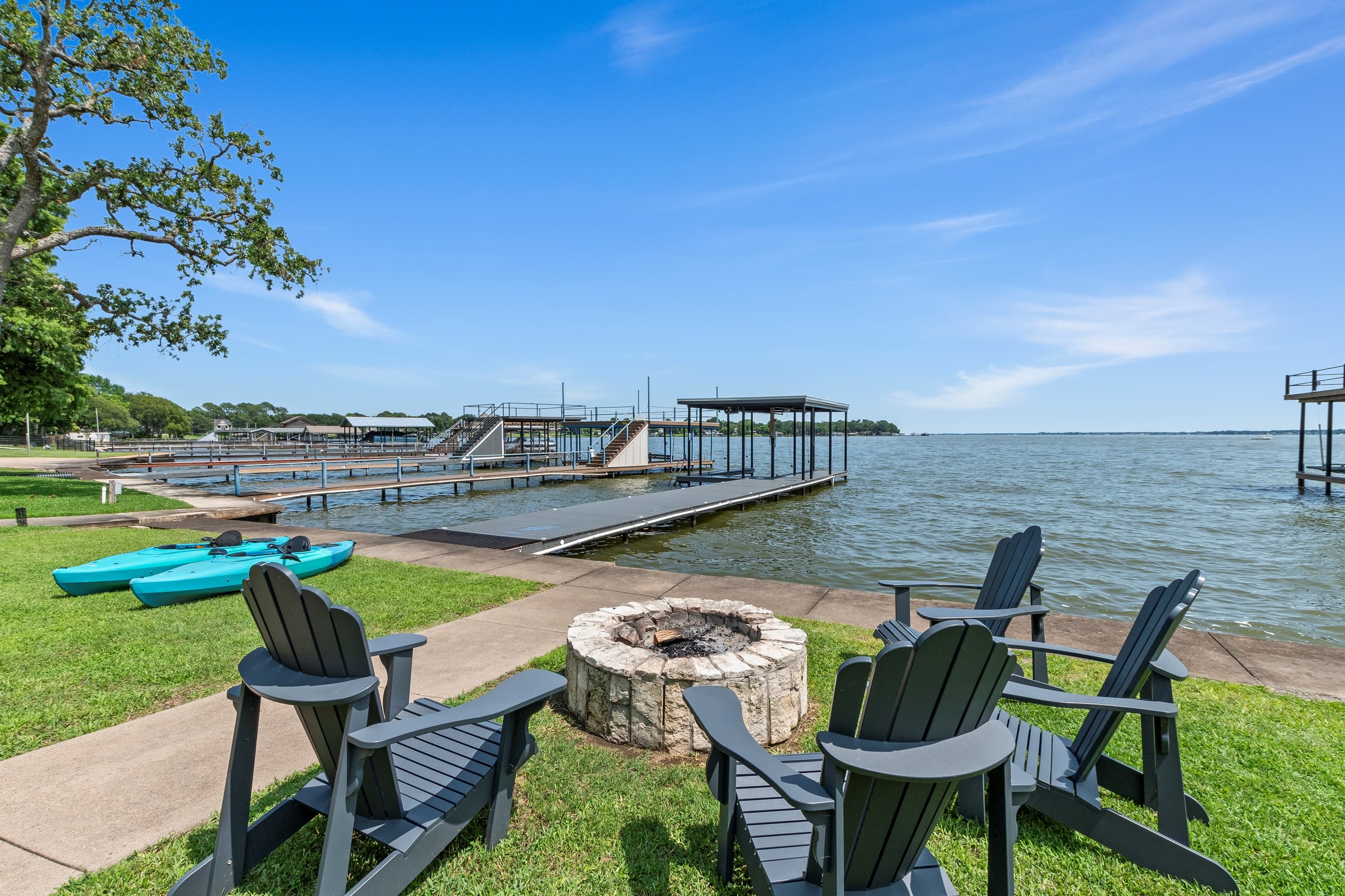 Gather around the firepit just steps from the lake—four chairs waiting for you to make s’mores and memories.