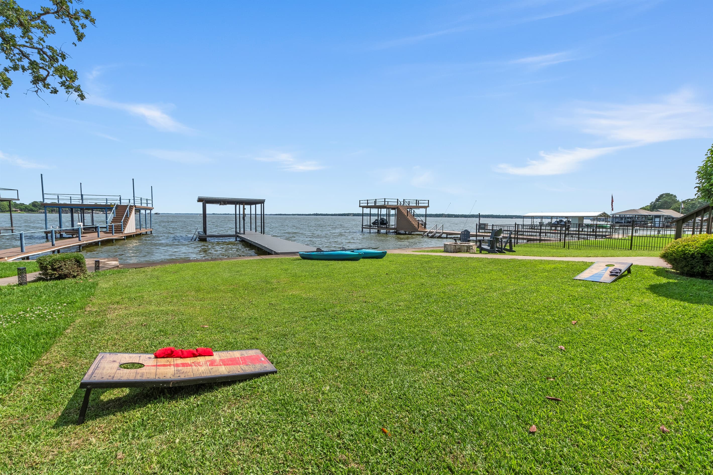 Enjoy some friendly competition with our provided cornhole set—perfect for outdoor fun by the lake!