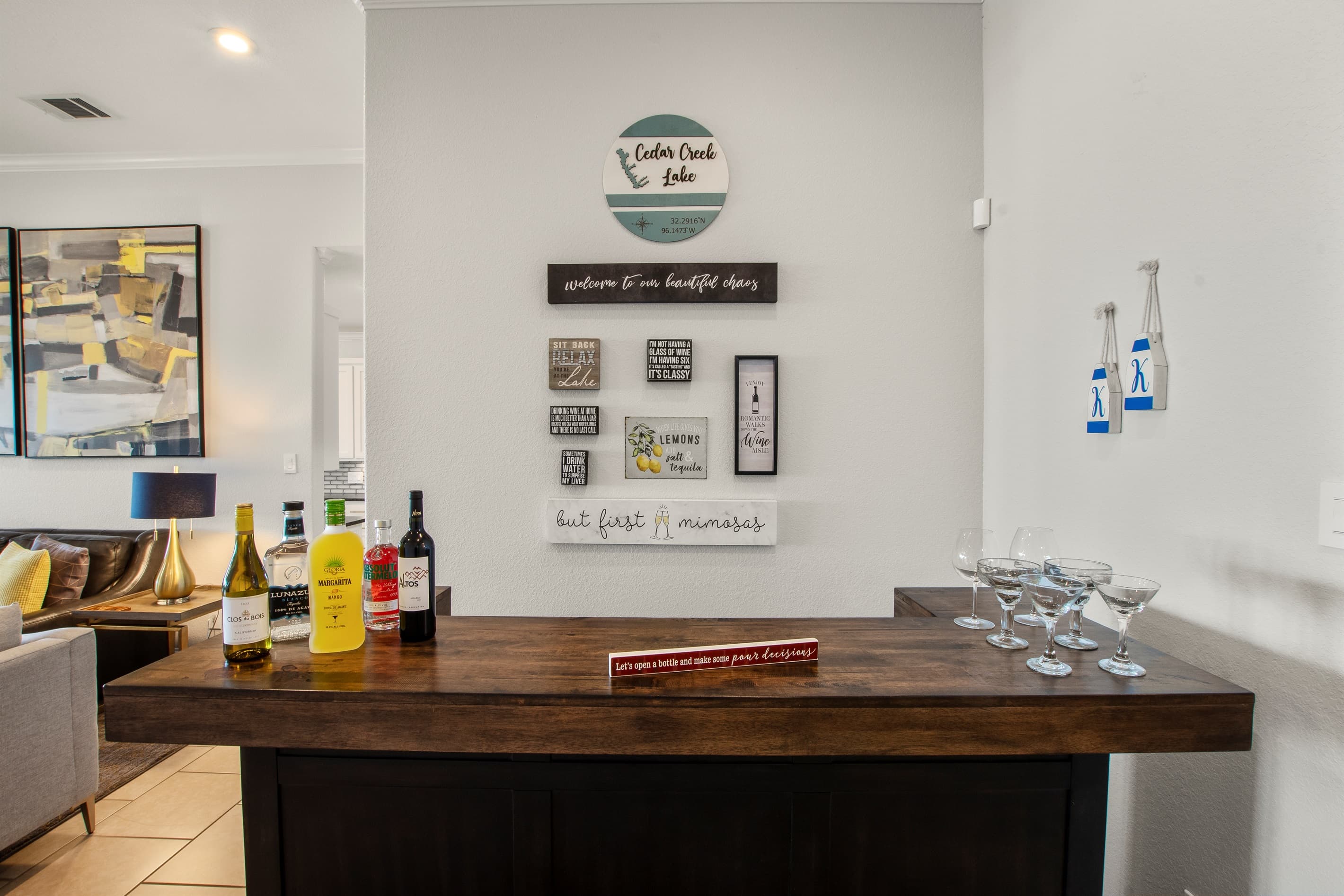 Your cocktail (or mocktail) hour just got an upgrade—martini, margarita, and cocktail glasses all set, cheeky bar signs for company, and just one rule: you bring the booze… or the juice!