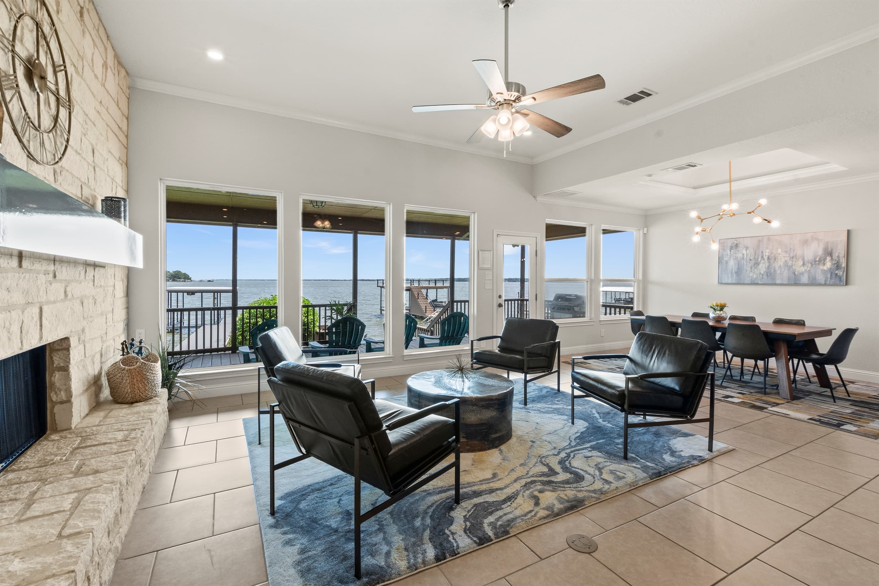 Enjoy cocktails and good company in the family and dining rooms, where expansive windows showcase breathtaking lake views.