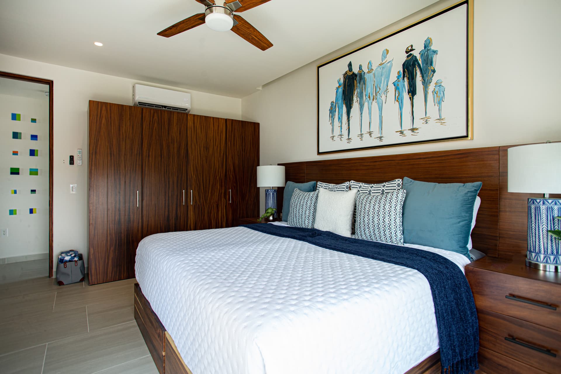 Bedroom 2: Wake up to ocean views from bed, then step outside onto the balcony to take it all in from the swivel chair — the spacious guest bedroom features generous closet and storage space and a 55" TV, making it a true home away from home.