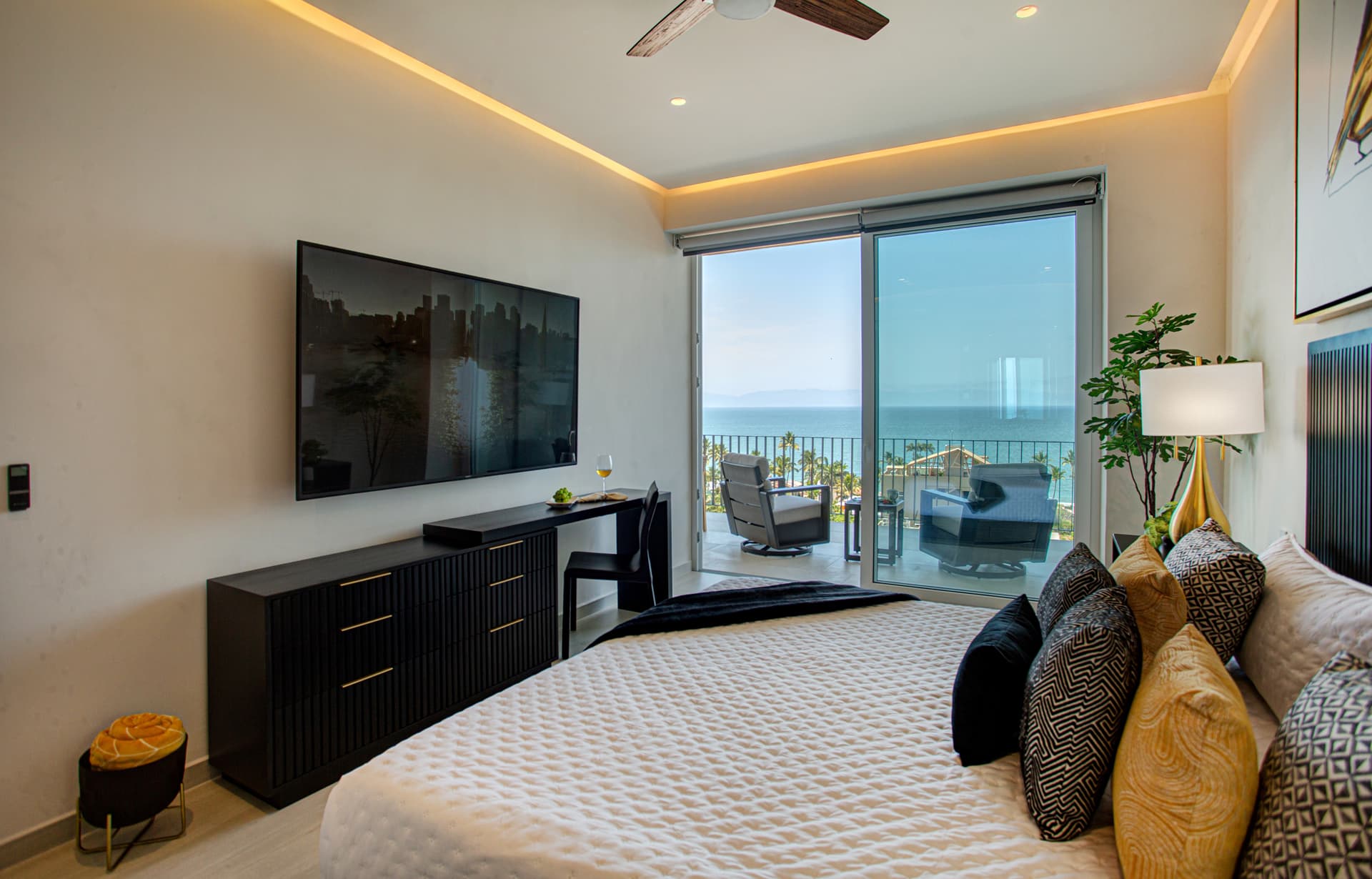 Primary Bedroom: Wake up to stunning views and stay productive.  The primary bedroom includes a dresser and expandable desk, giving you a second place to work beyond the dedicated study.