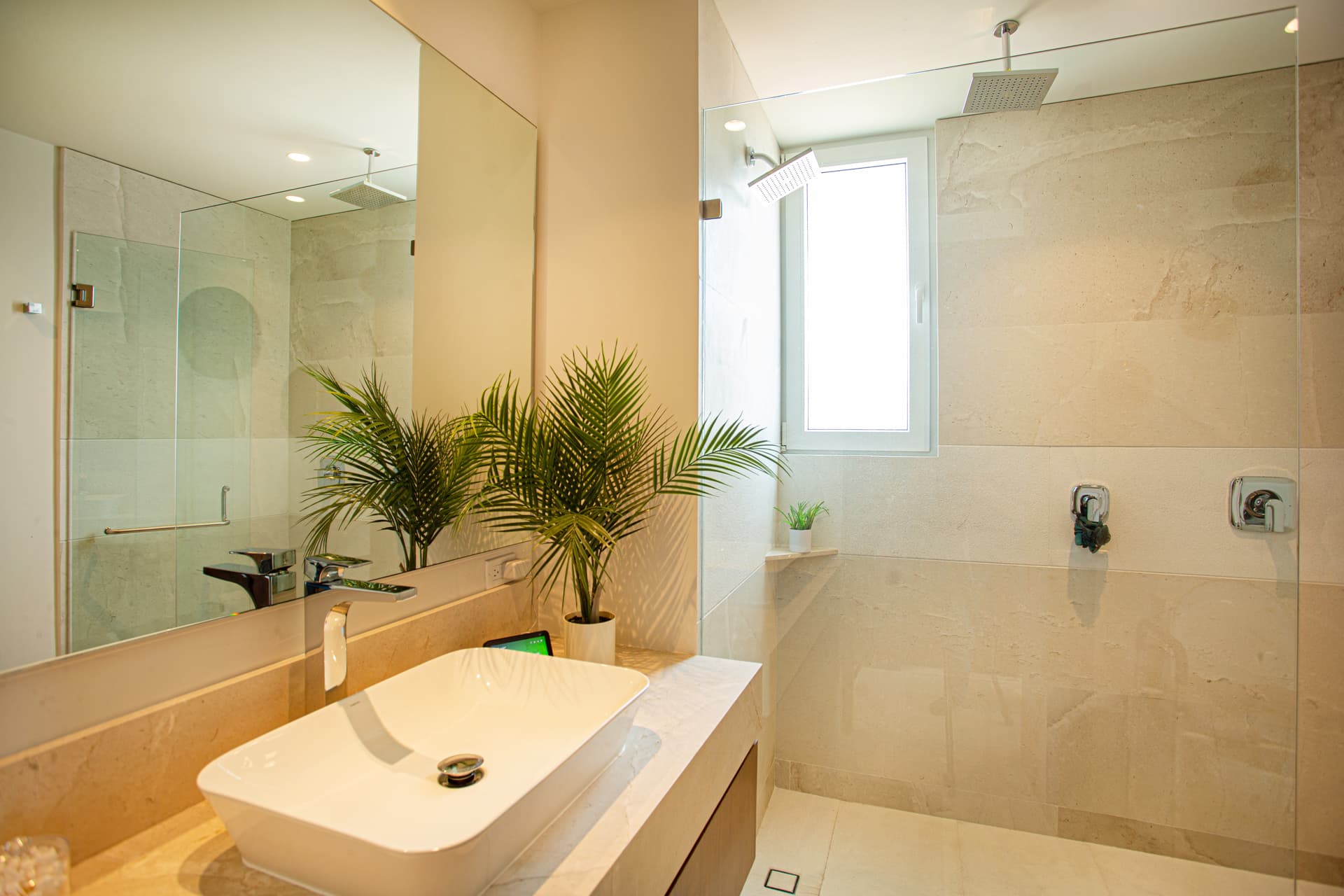 Spa-style ensuite bathroom featuring both a rain shower and standard shower, stocked with plush towels and premium shampoo, conditioner, and body wash for a relaxing, hotel-quality experience.